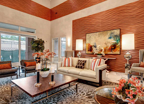 A living room with a leopard print rug and a painting on the wall.