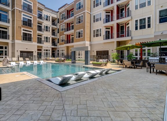 a swimming pool in the middle of an apartment building