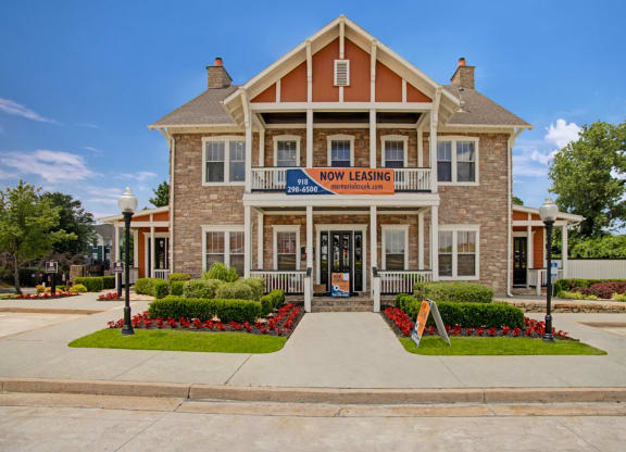 the front of the new learning center building with a sidewalk and landscaping
