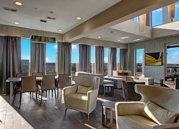 A large room with a table and chairs.