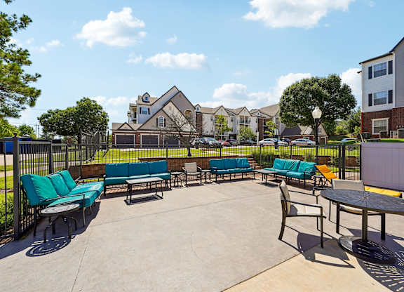 A sunny day at the outdoor seating area of a residential complex.