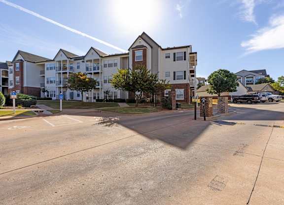A sunny day at a residential complex with a clear blue sky.