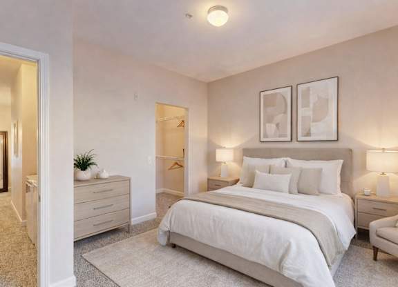 A bedroom with a large bed, two nightstands, and a chair.