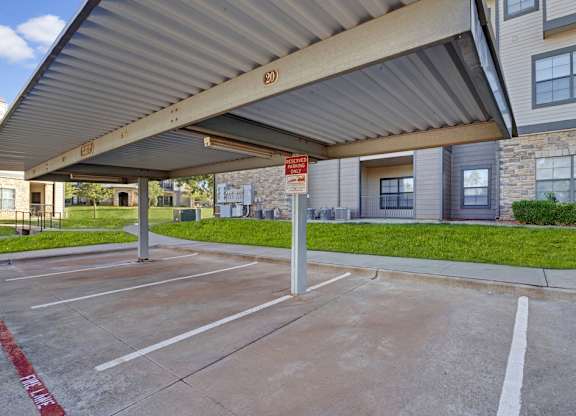 A parking lot with a red line painted on the ground.