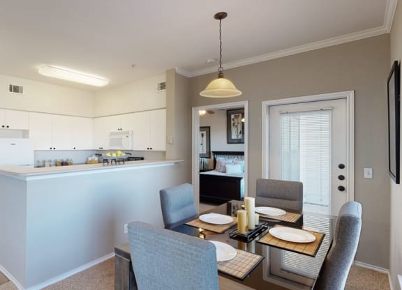 a kitchen and dining area in a 555 waverly unit