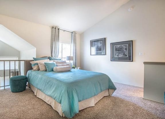 a bedroom with a bed and a balcony