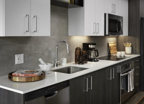 a kitchen with a sink and a refrigerator
