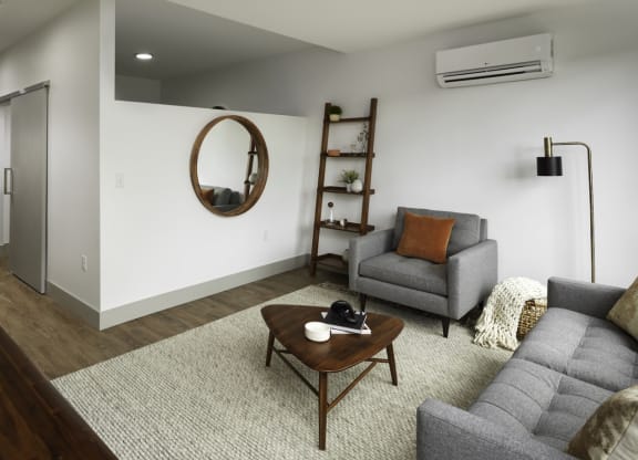 a living room with a couch and a table