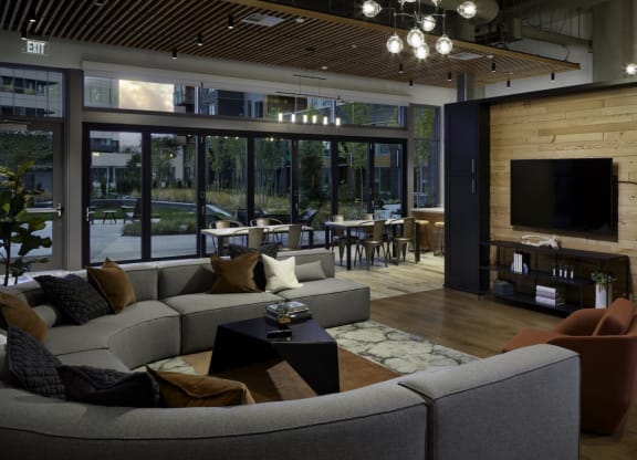 a living room with a couch and a table and a television