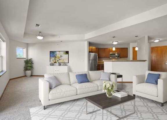 a rendering of a lobby with couches and a table