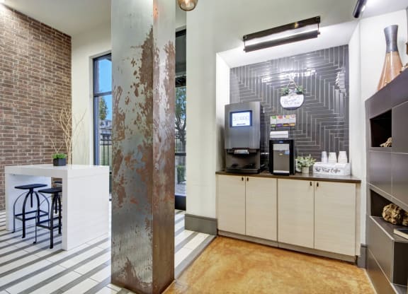 A lobby with a coffee bar and seating