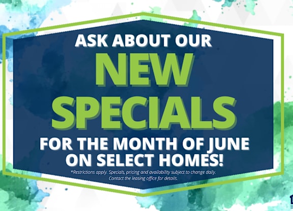 A sign advertising new specials for the month of June on select homes.