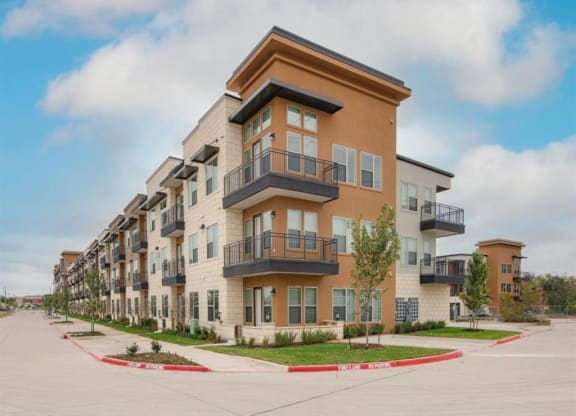 a row of apartment buildings with balconies