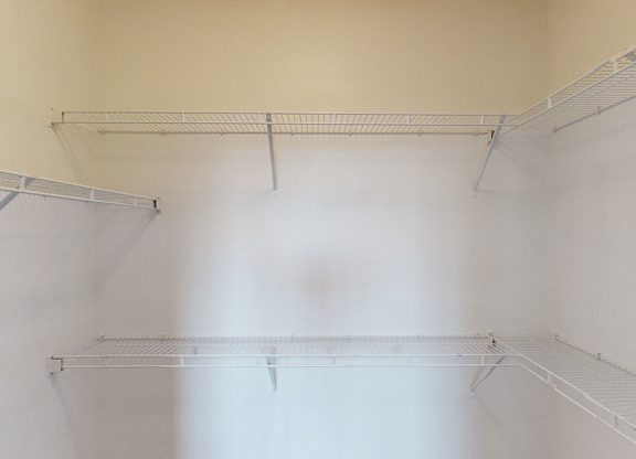 Empty shelves in a room with white walls.