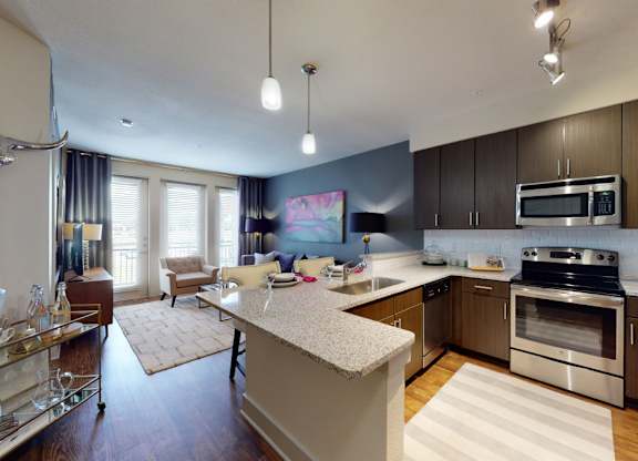 A modern kitchen with a cow skull on the wall.