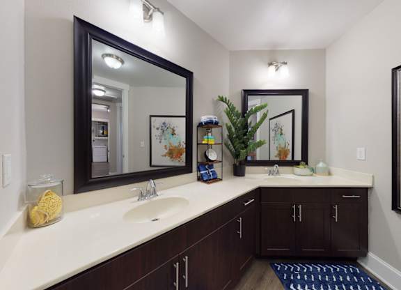 A bathroom with a sink, mirror, and a rug.