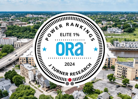 A cityscape with a circular logo overlay that reads