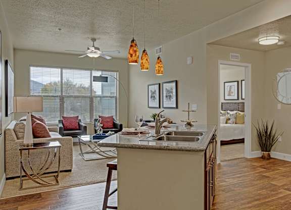 A kitchen with a dining table and chairs.