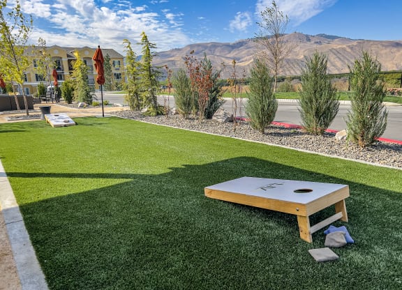 a patio with a ping pong table and a view of the mountains