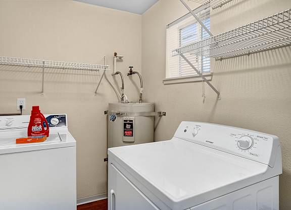 A laundry room with a washer and dryer.