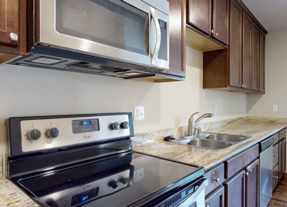 a kitchen with a stove and a sink