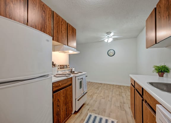 Cambridge West Kitchen Dark Cabinets White Appliances Apartments for rent in Edmonton, AB