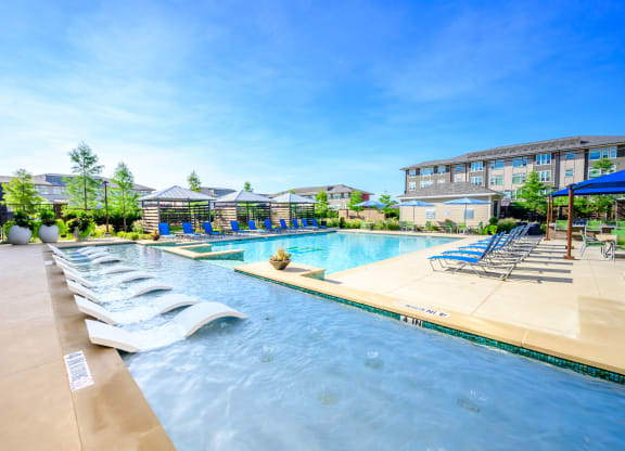 Harmony Luxury Apartments pool and entertainment area Apartments for rent Rowlett, TX 75089