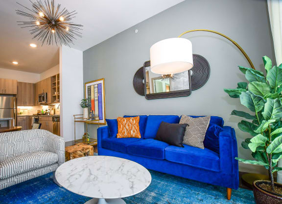 The Crosby at The Brickyard vibrant living room space Apartments in Farmers Branch, TX