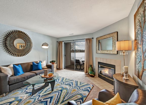 River's Cove living room with fireplaceoffer a living room with a fireplace