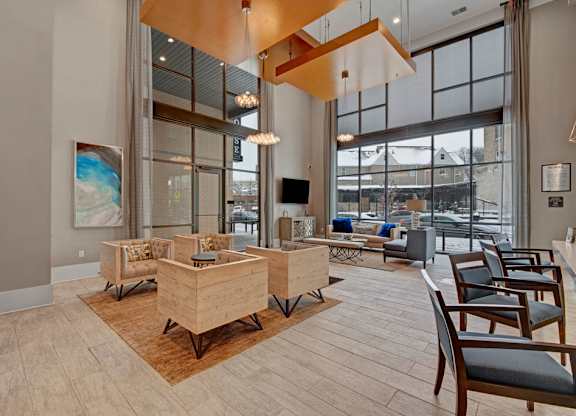A modern living room with wooden furniture and a large window.