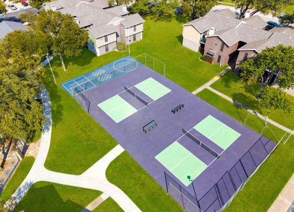 an aerial view of two pickle ball courts on a neighborhood court