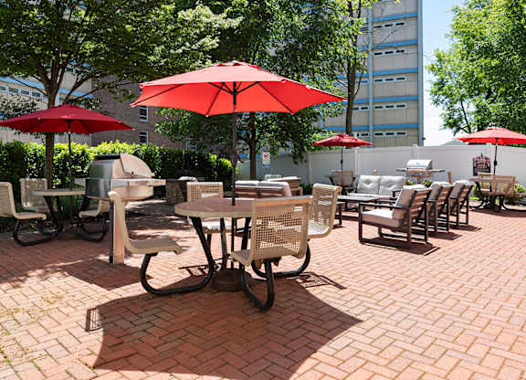 Beautifully designed outdoor courtyard with grills, shaded seating, and lounge spaces at Bridgepoint