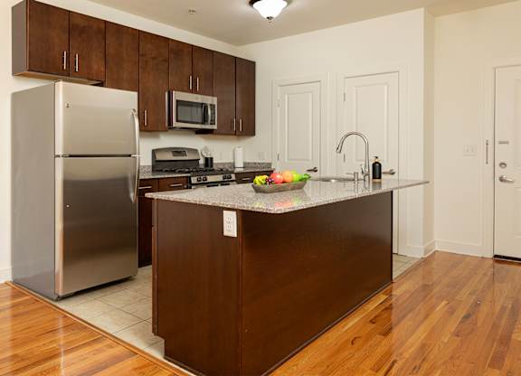 Well-appointed Bayonne NJ kitchen with granite countertops and stainless steel appliances