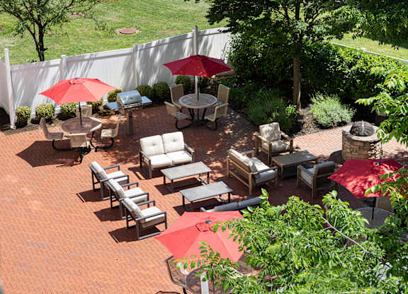 Elevated view of thoughtfully designed community courtyard with BBQ and social lounge seating at Bridgepoint at Bayonne