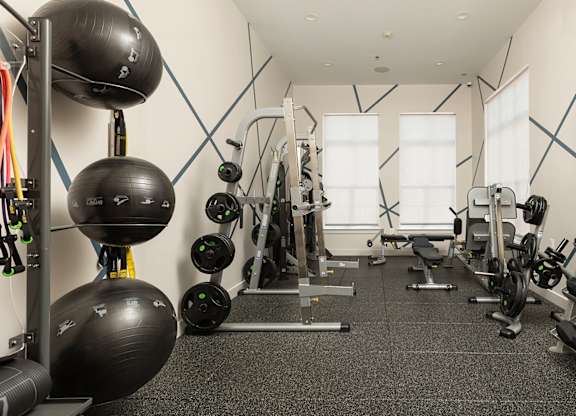 Well-equipped fitness studio with strength and resistance training gear at Bridgepoint apartments in Bayonne NJ