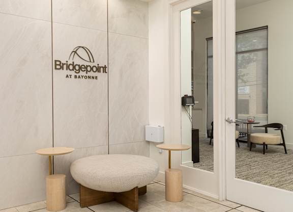 Bridgepoint at Bayonne apartments featuring a refined entry lobby with modern design and seating