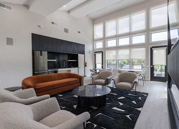 Community living room with couches at The Crest at Princeton Meadows, Plainsboro, NJ, 08536