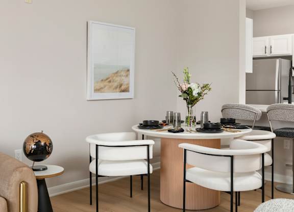 Elegant dining area in a newly renovated apartment at The Mews at Princeton Junction, Princeton, NJ, with contemporary furnishings and an open-concept design
