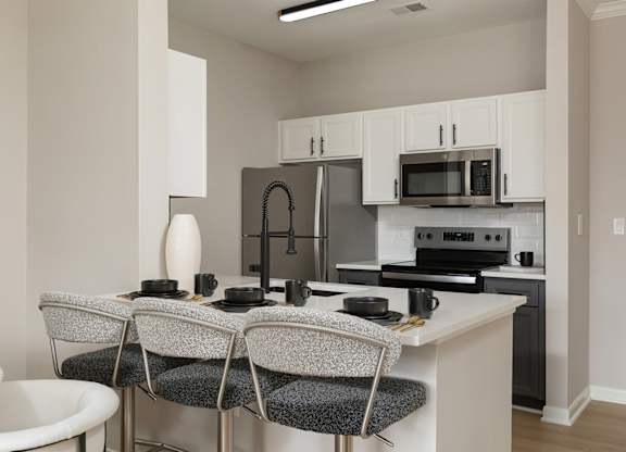 Renovated open-concept kitchen in a Princeton, NJ apartment for rent at The Mews at Princeton Junction. High-end appliances, modern finishes, and 2025 luxury apartment updates.