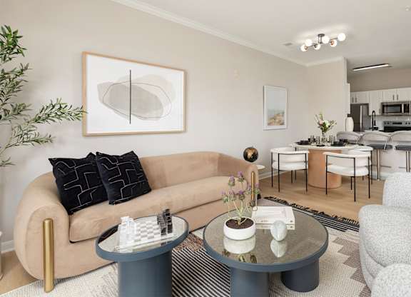 Modern 2025 newly renovated apartment living room at The Mews at Princeton Junction, featuring stylish furniture, large windows, and natural light in a spacious rental home