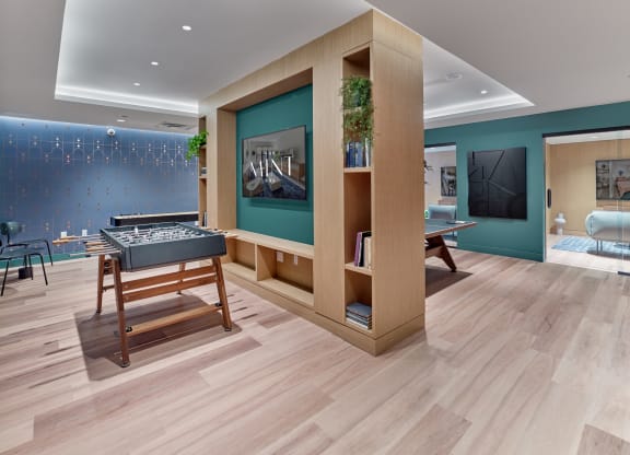 Spacious game room at The Mint Rahway with a foosball table, offering great amenities near Rahway Train Station and Coffee Box Rahway.