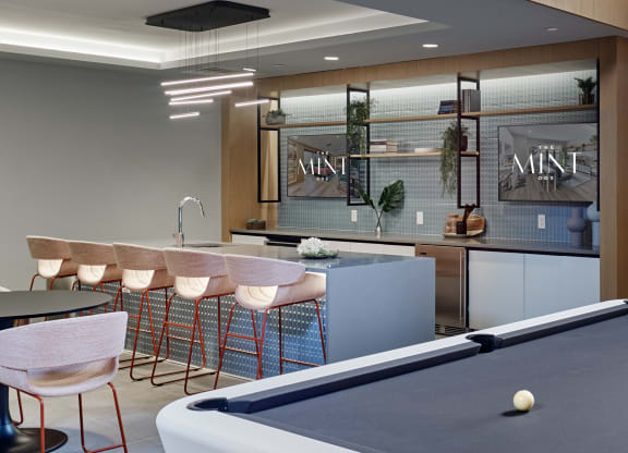 Modern kitchen and bar area at The Mint Rahway, an apartment community near Rahway Train Station and NYC.