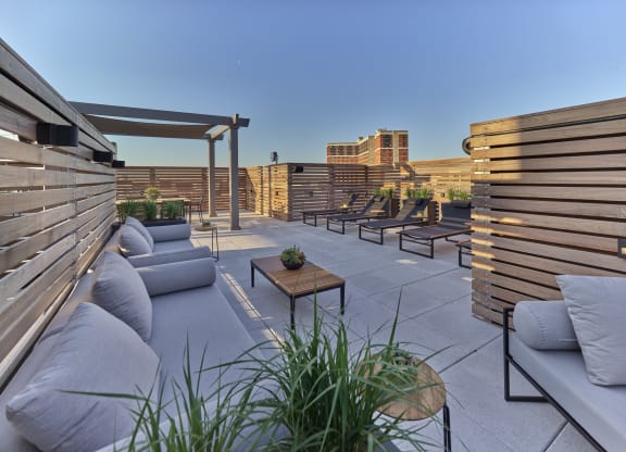 Comfortable outdoor lounge at The Mint Rahway with modern seating and city views, near Rahway Train Station and Union County Performing Arts Center.