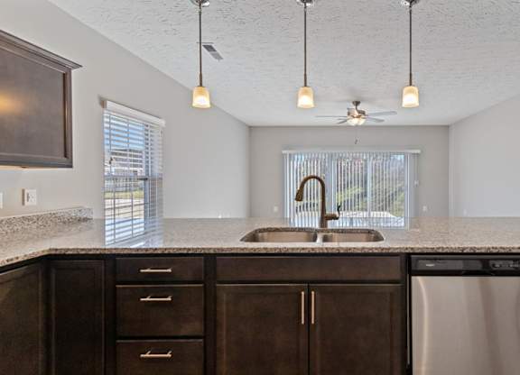 Modern kitchen with stainless steel appliances at The Villages of Florence and Weaver Mill