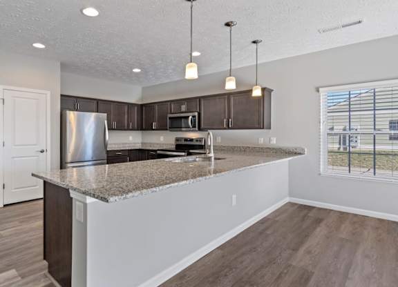 Dining area with pendant lighting and open floor plan in Florence, KY