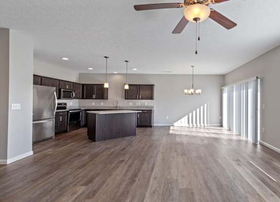 Spacious living room with hardwood-style floors in Florence, KY home
