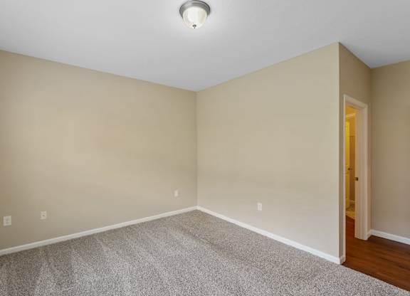 Bedroom with carpet and lighting at The Villages of Florence and Weaver Mill