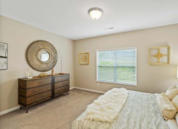 Cozy bedroom with large windows and blinds in Florence, KY ranch-style rental home