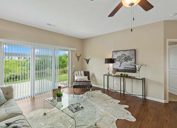 Living room with patio doors in a ranch-style home for rent in Florence, KY