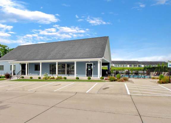 Resident clubhouse and leasing office with guest parking at The Villages of Florence and Weaver Mill